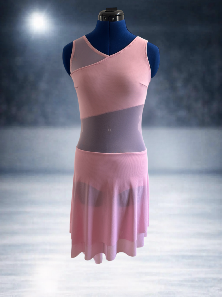 A rose pink figure skating dress with strong angled elements, with pink mesh cutouts and a swishy, angled skirt